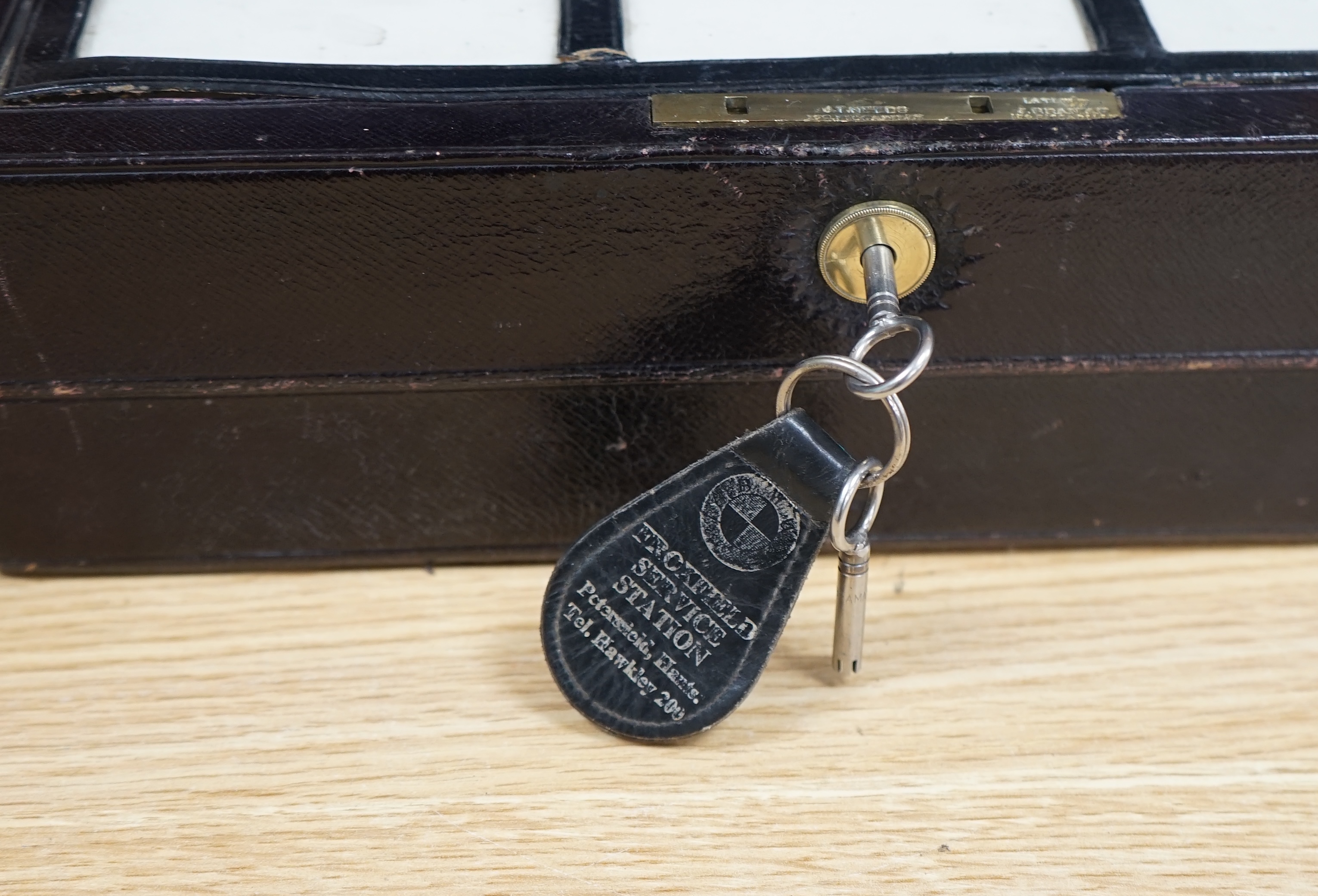 J.T. Needs, 128 Piccadilly, London, a travelling writing slope with Bramah Lock & Keys, 31cm wide. Condition - fair to good